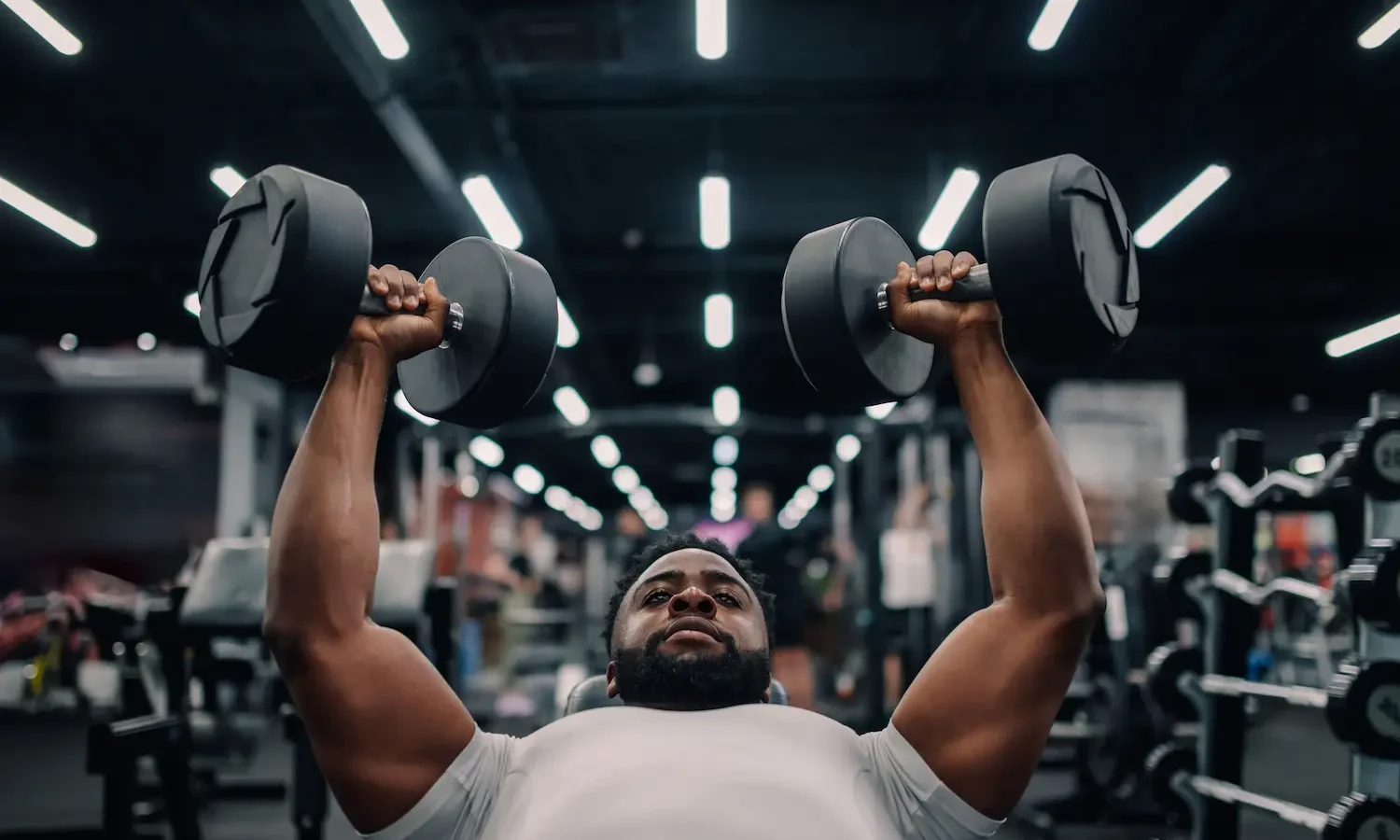 Dumbbell Bench Press: How to Do It, Muscles Worked & Common Mistakes