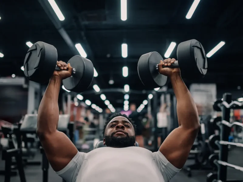 Dumbbell Bench Press: How to Do It, Muscles Worked & Common Mistakes